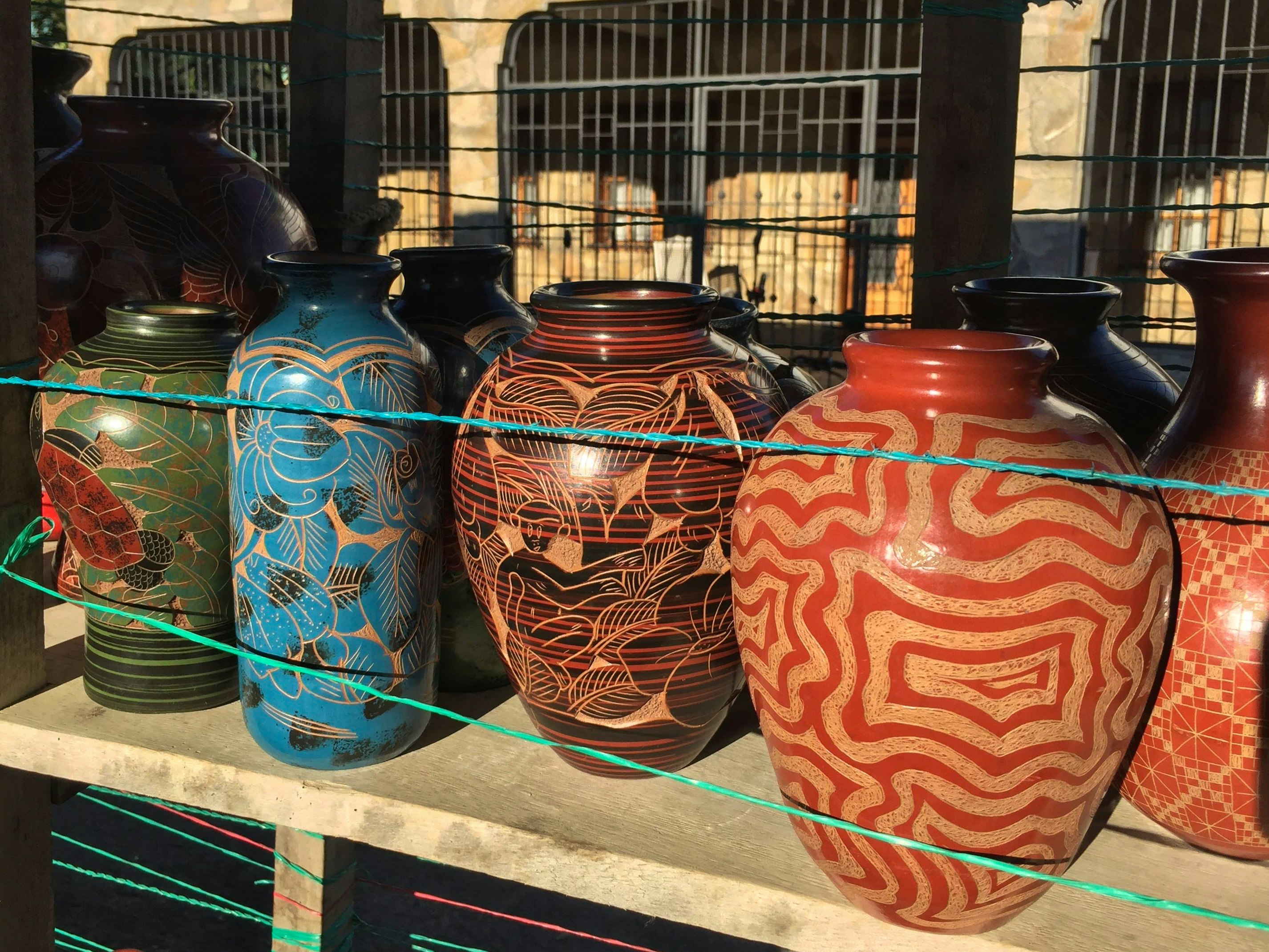 red blue and brown ceramic vases